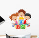 Children reading book and sitting on alphabet blocks Wall Decal