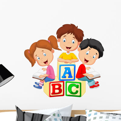Children Reading Book And Sitting On Alphabet Blocks Wall Decal shown on a wall