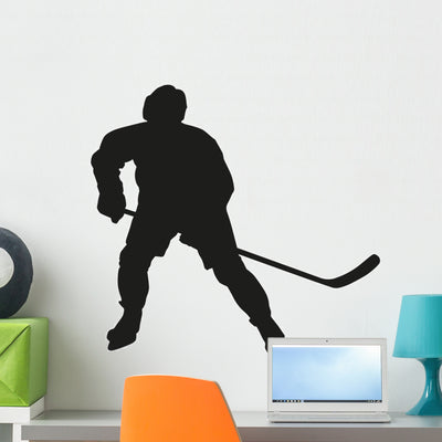 Ice Hockey Player Silhouette Wall Decal shown on a wall