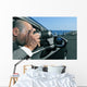 detective or paparazzi taking photos from inside a car Wall Mural