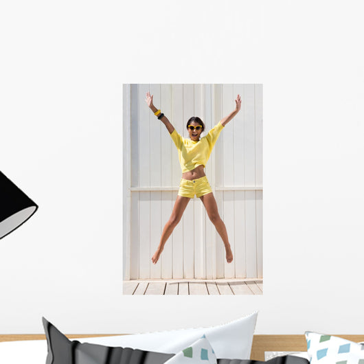 Happy Woman Jumping Wall Mural