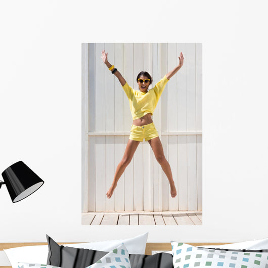 Happy Woman Jumping Wall Mural