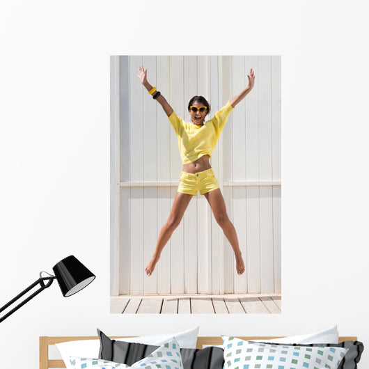 Happy Woman Jumping Wall Mural