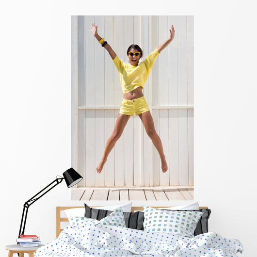 Happy Woman Jumping Wall Mural