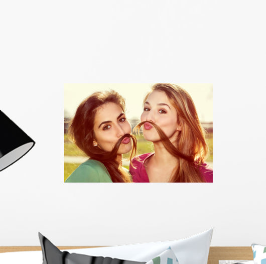 Two girls kid around Wall Mural