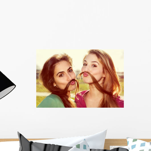 Two girls kid around Wall Mural