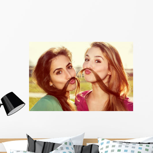 Two girls kid around Wall Mural