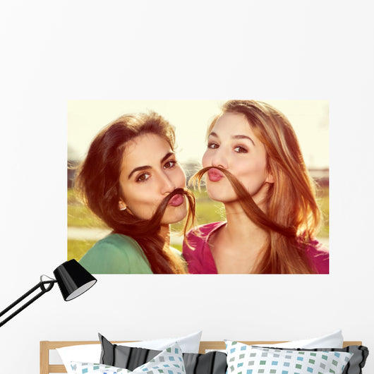 Two girls kid around Wall Mural