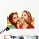 Two girls kid around Wall Mural