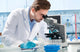 Scientist Looking through Microscope Wall Decal