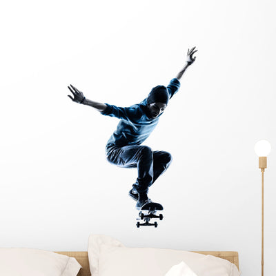 Man Skateboarder Skateboarding Silhouette Wall Decal shown on a wall
