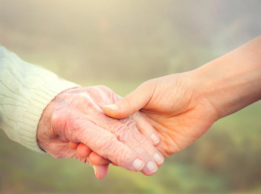 Elderly Woman Holding Hands Wall Decal
