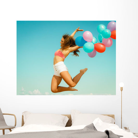 Girl Jumping with Colorful Wall Decal