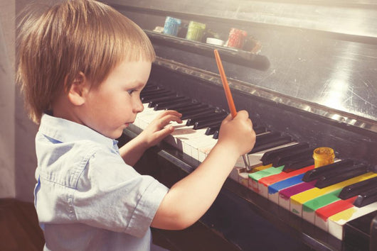 Young Boy Painting Piano Wall Decal