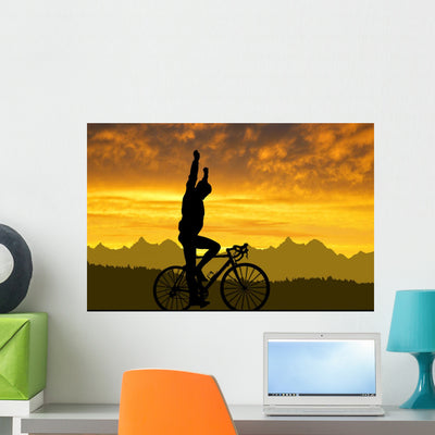 Silhouette Cyclist Riding Road Wall Decal shown on a wall