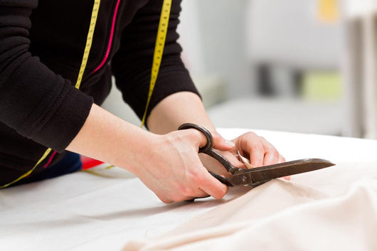Dressmaker Cutting Fabric with Wall Decal