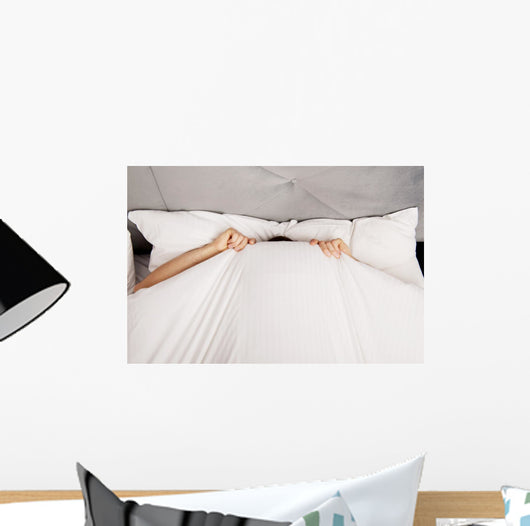 Man Hiding Bed under Wall Decal