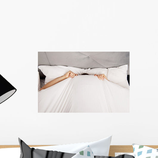 Man Hiding Bed under Wall Decal