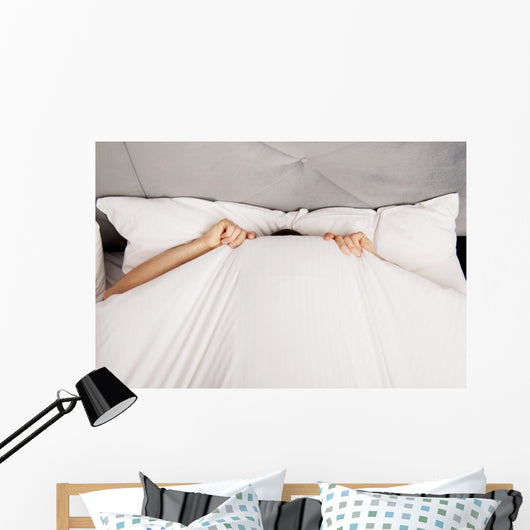 Man Hiding Bed under Wall Decal