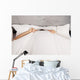 Man Hiding Bed under Wall Decal