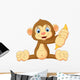 Cartoon Monkey Holding Banana Wall Decal