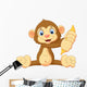 Cartoon Monkey Holding Banana Wall Decal