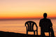 Man Sits Chair Alone Wall Decal
