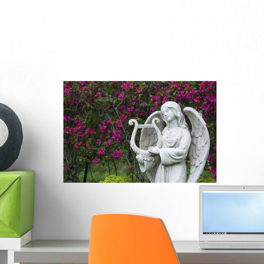 White marble statue of angel in flower garden Wall Mural