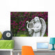 White marble statue of angel in flower garden Wall Mural
