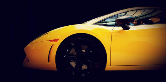 Modern fast car close-up side view on black. Luxury Wall Mural