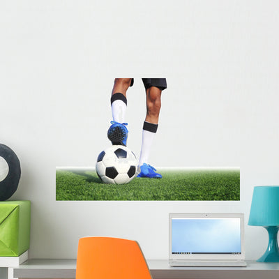Soccer Ball with Feet Wall Decal shown on a wall