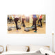 Group of women making step aerobics from the backside Wall Mural