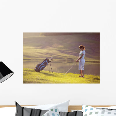 Young Female Playing Golf Wall Decal shown on a wall