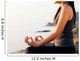 The woman meditating in a yoga pose on the tropical beach. Wall Mural