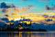 Dark silhouettes of palm trees and amazing cloudy sky at sunset Wall Mural