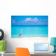 Grey heron standing on white beach on Maldives island Wall Mural