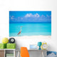 Grey heron standing on white beach on Maldives island Wall Mural