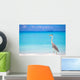 Grey heron standing on white beach on Maldives island Wall Mural