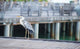 Grey heron standing on white beach on Maldives island Wall Mural