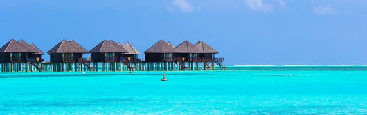 Water villas, bungalows on ideal perfect tropical island Wall Mural