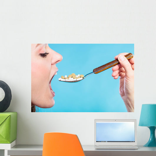 Young Woman Eating Pills Wall Decal