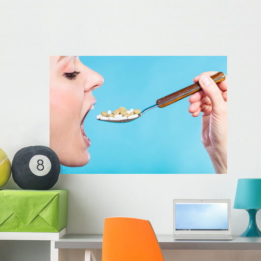 Young Woman Eating Pills Wall Decal