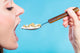 Young Woman Eating Pills Wall Decal