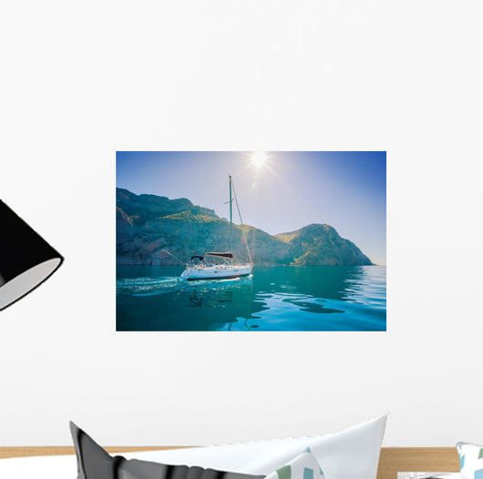 Yacht sailing along the shore the sea in calm weather. Wall Mural