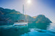 Yacht sailing along the shore the sea in calm weather. Wall Mural