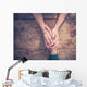 Man and woman holding hands at a table Wall Mural