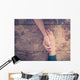 Man and woman holding hands at a table Wall Mural