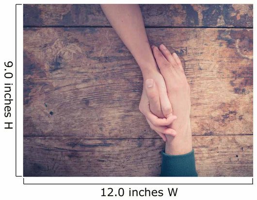 Man and woman holding hands at a table Wall Mural