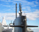 Naval fleet. Submarine and warships with guns. Wall Mural