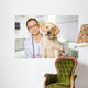 Veterinarian. Vet using technology with a little dog - isolated Wall Mural